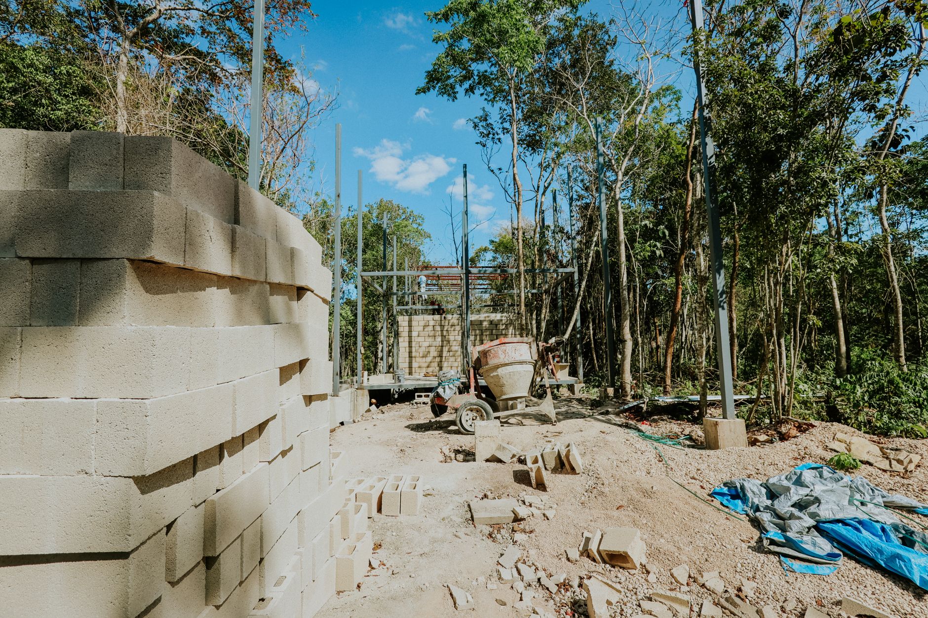 A block retaining wall part-built on a cleared bank